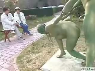 Grön japanska trädgårds statues fan i offentlig